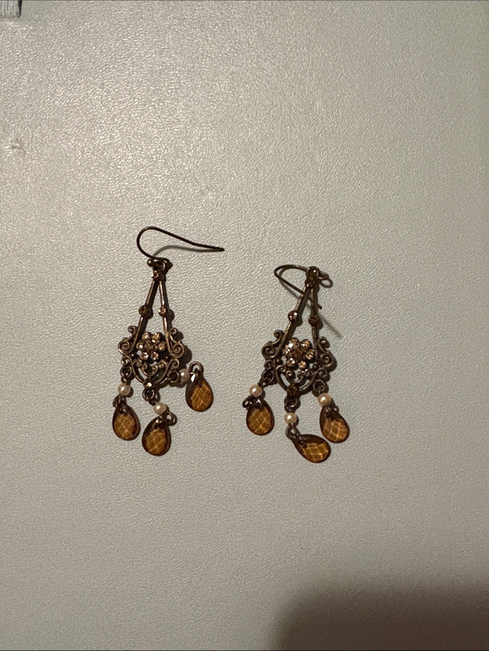 Dangly earrings with amber/yellow gems